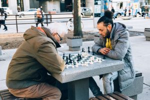 Two men playing chess on the street