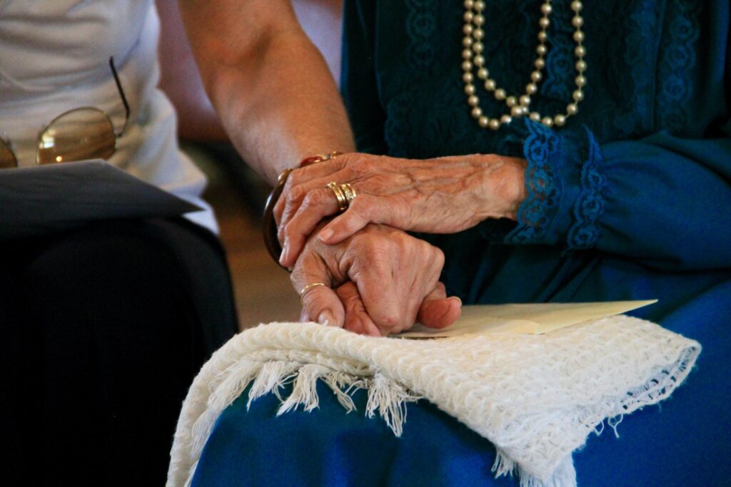 grandma-holding-daughters-hand-elderly-adult-dementia